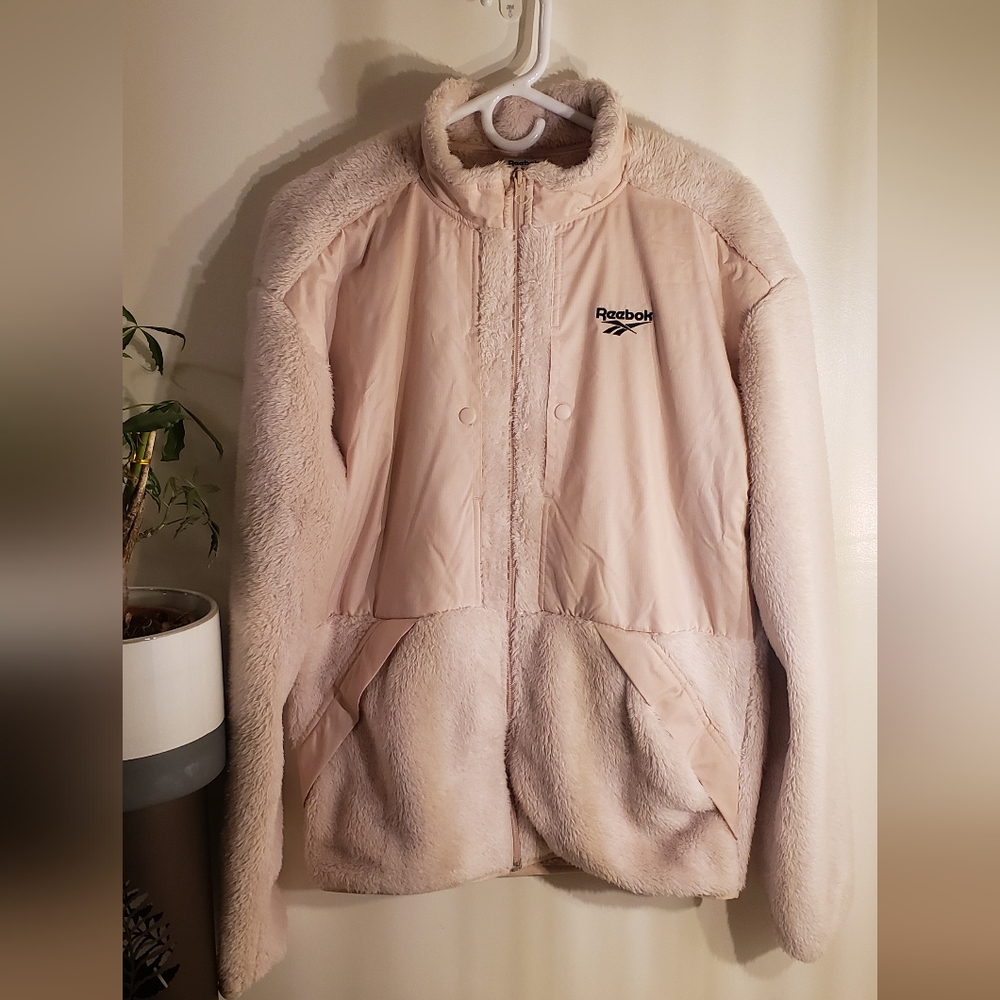BRAND NEW W/ TAGS. REEBOK SIZE SMALL JACKET.